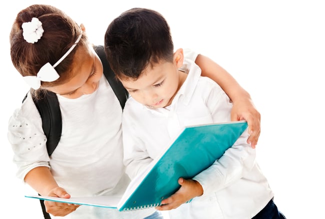 Preschool kids holding a notebook - isolated over a white background
