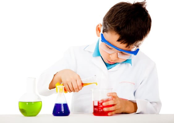 Boy at the lab making scientific experiments - isolated over white