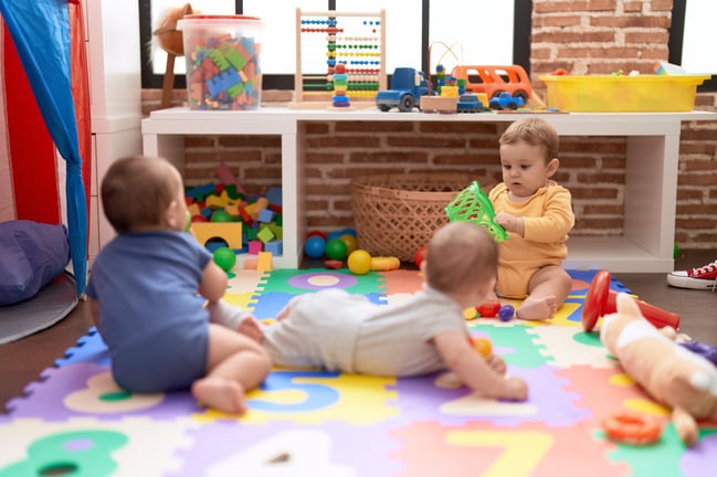 group-toddlers-playing-with-toys-crawling-floor-kindergarten