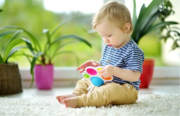 toddler playing with toy